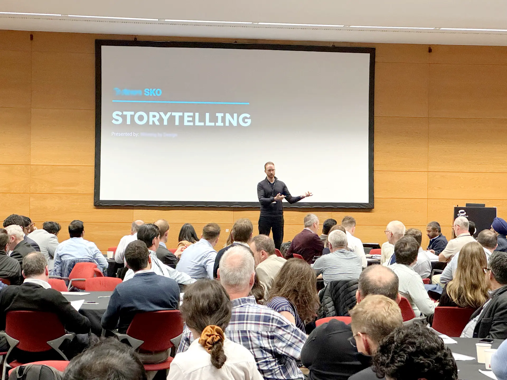Boris presenting a storytelling session on stage at a sales kick-off